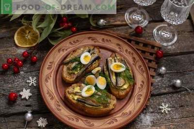 Sandwiches with sprats on the holiday table